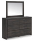 Hollivern King Panel Bed with Mirrored Dresser and Chest