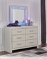 Zyniden Full Upholstered Panel Headboard with Mirrored Dresser, Chest and Nightstand