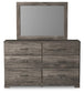Ralinksi King Panel Bed with Mirrored Dresser, Chest and Nightstand